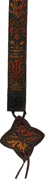 This bookmark was made in Italy by an unknown manufacturer. It is marked made in Italy on the back. It is a leather bookmark with an embossed design that is hand painted. The date is unknown.  