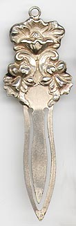 This bookmark was made in the US by an unknown manufacturer. It is marked Sterling 925/1000 on the back. It is an art nouveau flower design. The date is 1900 - 1910.