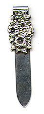 This bookmark was made in the US by an unknown manufacturer. It is marked only sterling. The top blade is a bouquet of forget-me-nots. The date is 1900 - 1910.
