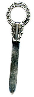 This bookmark was made in the US by Unger Bros. It is marked with the makers hallmark and Sterling 925 Fine. It is an art nouveau flower wreath design. The date is 1900 - 1910.