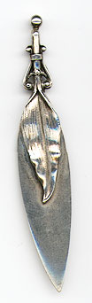 This bookmark was made in the US by Gorham. It is marked with the makers hallmark, sterling and the number 33. The top blade is in the shape of a leaf. It is one of 33 bookmarks sold in the Autumn 1888 silver catalog. 