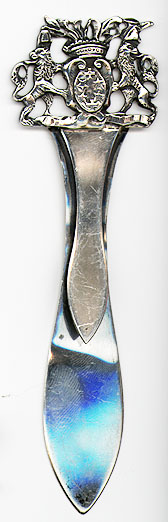 This bookmark was made in Germany. It is marked with hallmarks that look almost like English hallmarks but aren't. The top has two griffins holding a shield between them. 