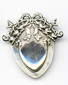 This bookmark was made in the US by La Pierre. It is marked with the manufacturers hallmark, sterling and 1681. It is a small bookmark with a fancy ribbon motif on the top. 