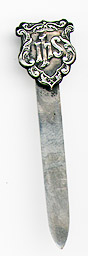 This bookmark was made in the US by an unknown manufacturer. It is marked only sterling. The top is a shield with the letters ihs. The date is 1900 - 1904.