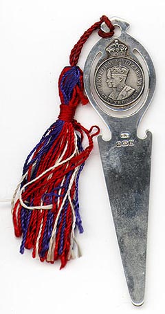 This bookmark was made in England. It has the hallmarks for Birmingham and 1936. The top has a medallion which says George VI and Elizabeth crowned 1937.