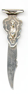 This bookmark was made in the US by Watson Company. It is marked Sterling with a dollar sign on each end. The top has a relief image of a tulip. The date is 1900 - 1910.