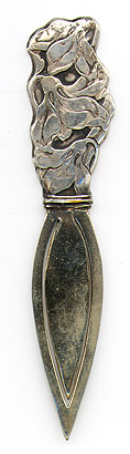 This bookmark was made in the US by Webster Co. It is unmarked. The top is a figural flower. This was sold by Webster as a letter opener in their 1913 silver catalog.