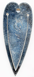 This bookmark was made in the US by Benedict Mfg. Co. It is marked with the manufacturers hallmark of a four leaf clover and Sterling. It is a simple bookmark of an elongated heart. Date is 1900 - 1910.