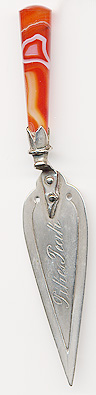 This bookmark was probably made in Scotland. It is in the shape of a trowel with an agate handle. The center blade is inscribed Pikes Peak. The date is 1900 - 1910.