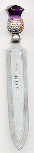  This bookmark was made in Birmingham, England. It is marked the manufacturers mark and the hallmarks for Birmingham and the year 1907. The top is a purple garnet thistle  