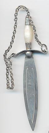  This bookmark was made in Birmingham, England by Mitchell Brothers. It is marked with the manufacturers mark, and the hallmarks for Birmingham and the date of 1888. It is in the shape of a sword with a mother of pearl handle and a chain.  