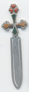  This bookmark was made in Birmingham, England by J.C. and S. It is marked with the manufacturers mark, and the hallmarks for Birmingham and the date of 1895. It is in the shape of a sword with three different colored stones on the top.  