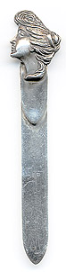  This bookmark was made in the US by an unknown manufacturer. It is marked sterling on the back. The top is a a picture of a "Gibson Girl" made famous by the artist Charles Gibson in the early 1900's. The date is 1900 - 1915.  