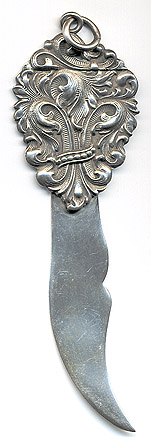 This bookmark was made in the US by an unknown manufacturer. It is marked sterling 1603 on the back. It is a large piece with an art nouveau design as the top blade. The date is 1900 - 1910.