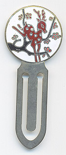  This bookmark was made in China. It is unmarked and is made of brass and cloisonne enamel. The top is a picture of a deer jumping over a tree branch. 