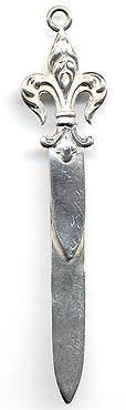  This bookmark was made in the US by an unknown manufacturer. It is marked sterling  1653 on the back. The top has fleur-de-lis and a ring which probably had a tassel at one time.  The date is 1900 - 1910.   