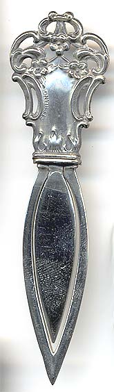  This bookmark was made in the US by Webster Company. It is only marked Sterling and the top and is in the shape of something art nouveau. It was made in 1913 and was sold as a letter opener and as part of a novelty set.    