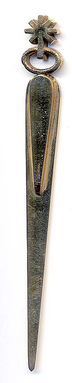  This bookmark was made in Europe by an unknown manufacturer. It has a manufacturers hallmark on the back. It is long and thin and doubles as a letter opener. The date is unknown.   
