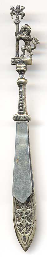  This bookmark was made in Italy. It is marked Italy on the front and Bordini on the back. Made of brass with silver plating, the top has a figure of a lion holding a staff with a fleur-de-lis on top. Under the lion is the word Firenze (which means Florence). The date is 1920 - 1930.   