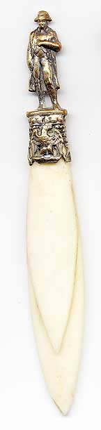  This bookmark was made in France. It has a brass 3D figural of Napoleon in his famous pose with one hand in his vest. The blades are made of celluloid. The date is 1900 - 1910. 