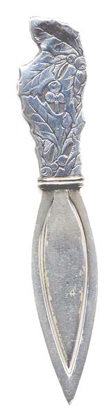  This bookmark is made in the US by Webster Co. It is marked sterling on the back. The top has a picture of holly. Date is 1913 and was sold as a letter opener and as part of a novelty set.   