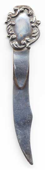  This bookmark was made in the US by an unknown manufacturer. It is marked with a worn hallmark, Sterling and 451. The top is an art nouveau shield.  The date is 1900 - 1910. 