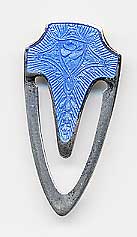  This bookmark was made in the US by F.A. Hermann Co. It has a hallmark on the back along with the word sterling. The top and the inner blade are finished in blue enamel. The date is 1900 - 1910.  