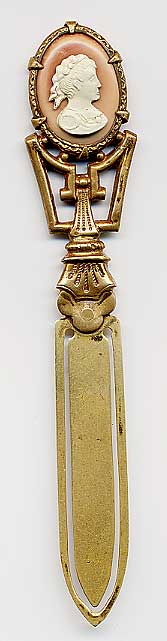  This bookmark was made in France. It is unmarked gilded brass and has a cameo on top. The date is 1890 - 1910.  