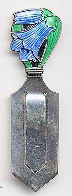  This bookmark was made in Norway. It has an art nouveau enamel flower design at the top. It is marked Sterling made in Norway. The date is 1920 - 1930.  
