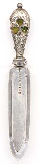  This bookmark was made in the Birmingham, England by J.C & S. In addition to the silver hallmarks, it has a patent number 15200 on the back. The top has three inlaid green agate stones in the shape of a clover. The date is 1906. 