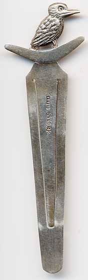 This bookmark was made in Austrailia by Prond. It is marked STG 925 for sterling. The to is a figural bird, possibly a woodpecker sitting on a boomarang. The date is 1950 - 1970.