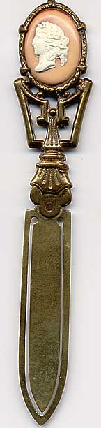  This bookmark was made in France. It is unmarked gilded brass and has a cameo on top. The date is 1890 - 1910.  