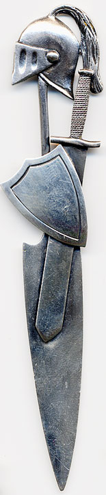 This bookmark is made in the US by Gorham. It is marked the the manufacturers hallmark and the number 52. It is a figural piece of a Roman helmut, sword and shield. The date is 1888. 