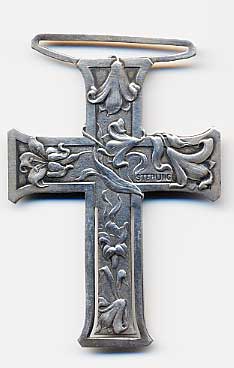  This bookmark is made in the US by Webster. It is only marked sterling. It is in the form of a cross with flowers. The top look normally holds a ribbon with a tassel.    