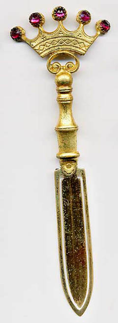  This bookmark is made in Europe of brass and gold painted metal. the top is a crown with 5 ruby colored glass stones.  The date is 1900 - 1920.  