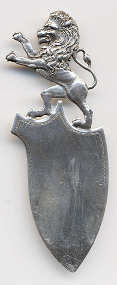  This bookmark is made in the US by Shiebler. It is marked with the makers mark and 2273. The top has a very detailed figural lion standing on it's two hind legs with his front paws in the air. There is a small second blade behind the front blade.  The date is 1900 - 1910.  