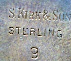 This bookmark is American made by S Kirk & Sons. It has S Kirk & Sons Sterling marked on the back with the number 9. I have 4 of these bookmarks. They all look exactly the same except one is solid and the others are indented on the back where the flowers are at the top. 