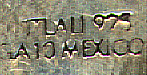 This bookmark is made in Mexico. It has an enamel design on top of what I don't know. It is marked 925 GA10 Mexico on the back. It has other letters marked on the back but I cannot make all of them out. It is probably the manufacturers mark. I cannot determine it's age.