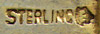 This bookmark is Canadian made circa 1920 - 1930. On the blade is written Victoria BC. At the top there is a crest made of enamel. The inscription, "Honi Soit Qui Mal Y Pense" means 'evil to him who evil thinks' in old Norman French. It is finished in a gold wash and is marked with a hallmark and the word Sterling.