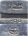 This bookmark was made in Denmark by Georg Jensen sometime after 1945. It is a fish hooked to a chain. The other end of the chainis a ball. This can also be seen in the new 1997 book on Georg Jensen silver.