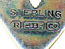 This bookmark is marked Sterling with the makers hallmark. It was made by R. Blackington & Co. circa 1900. I have two of these bookmarks. On one of them, the hallmark is on the front, and the other has the hallmark on the back. One was a goof. But which one?