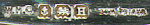 This bookmark was made in Birmingham England. It is marked W.H.C. BCM/PRIAUR. The date mark is H indicating is was made in 1932. It is a kewpie doll on the top of the bookmark.