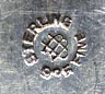 This bookmark was made in the US by Unger Bros. It is hallmarked with the manufacturers mark of an intertwined U and B. The top is a rose flower just starting to bloom. To see the catalog page select "Catalog Unger Bros 1904" from the Books, Catalogs and Patents dropdown menu.