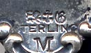 This bookmark was made in the US by Gorham. It is hallmarked on the back with the Gorham mark of lion, anchor, G and the date letter M signifying 1880. The top blade has a fancy design which could possibly be letter for some organization and the date 1872 - 1897.