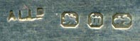This bookmark  was made in Birmingham England. It has the hallmarks for sterling and the year 1896. It is in the shape of a knife with a handle that looks like a flower.