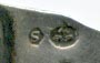 This bookmark was made in Denmark and imported into Sweden. It is marked H.J. 830s and has the Swedish import marks. The top is the face of an owl. The top blade is inscribed 26.I.1921.  