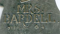 his bookmark was made in the US by J.F. Fradley. It is marked on the back with sterling, the manufacturers hallmark of a cross, the numbers 1863 and 4, and Mrs. Bardell. This is a figure of the Dickens character Mrs. Bardell from the book 'The Pickwick Papers.'" The date is 1890 - 1936. "