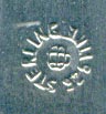 This bookmark was made in the US by Unger Bros. The top is a heart shape with an angel/cherub kissing someone in the water. 