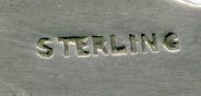 This bookmark was made in Canada or the US by an unknown manufacturer. It is in the shape of a trowel with the handle in the shape of a beaver on a tree branch. The middle blade says Montreal. It is marked sterling on the back.