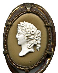 his bookmark was made in France. It is unmarked gilded brass and has a cameo on top. The date is 1890 - 1910.